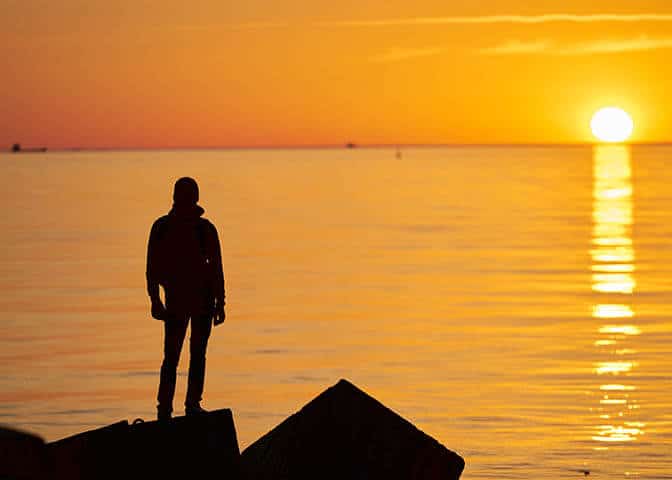 Man Looking Out Into the Ocean