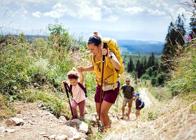 Woman Hiking With Her Family